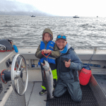 Brian Liebert and His Son Pose with A Chinook Salmon